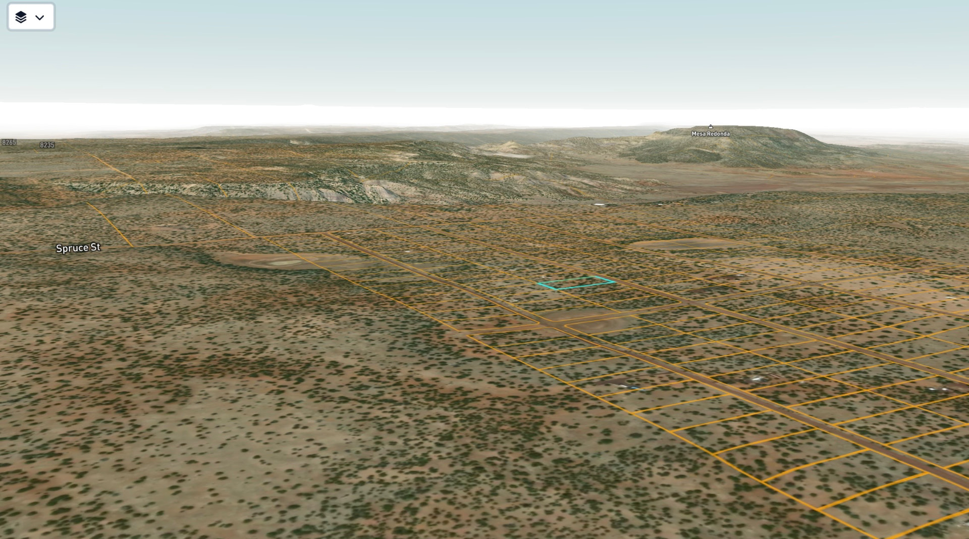 Aerial view of Lot #11 outlined in teal with Mesa Redonda on the horizon