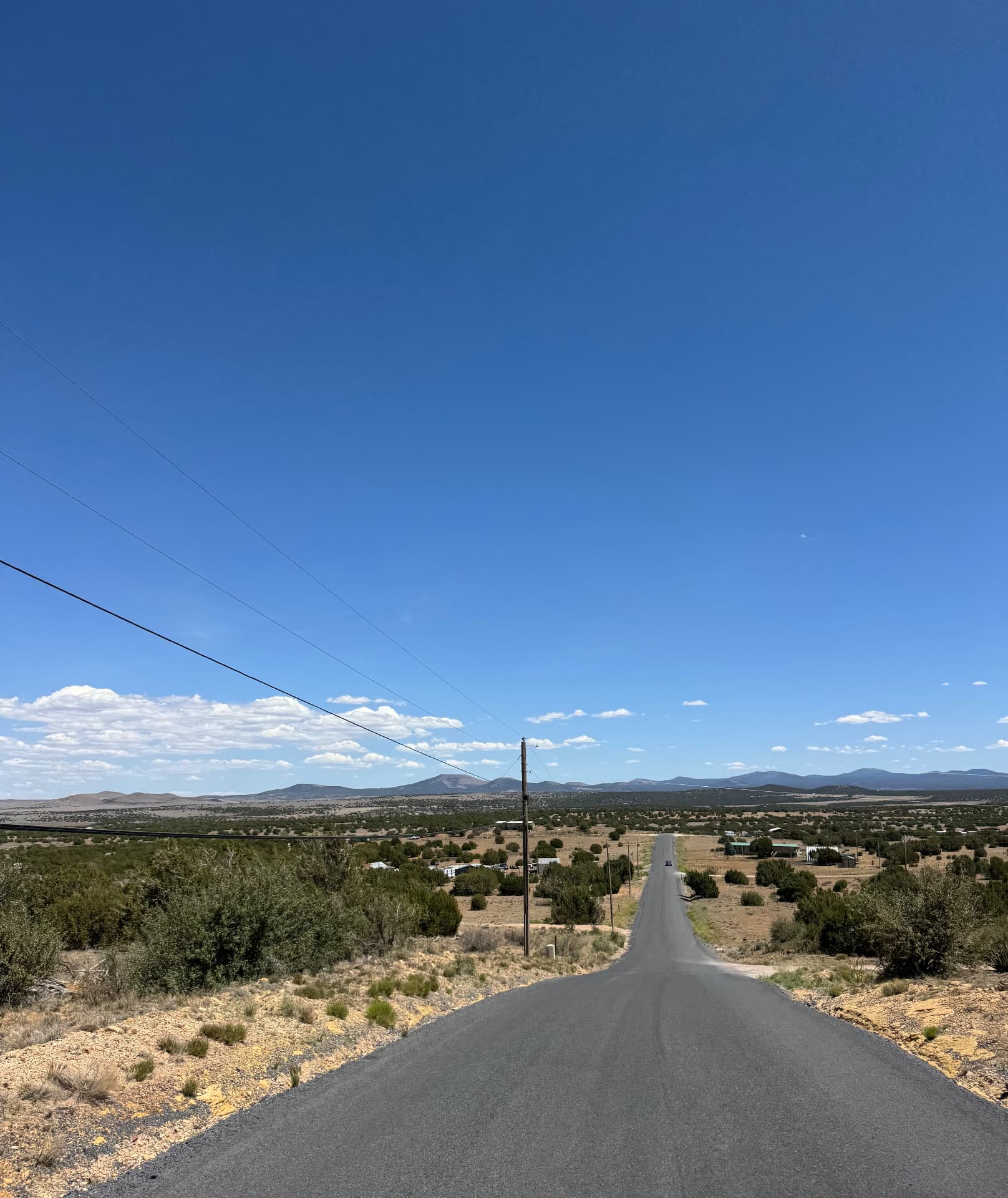 Paved county road leading into the Show Low Pines Unit 5 subdivision
